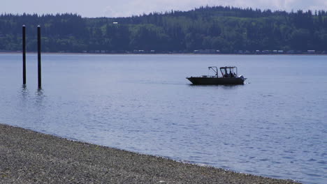 small, nondescript fishing floating near dock at camano island state park, wa state 30sec-60fps version 6