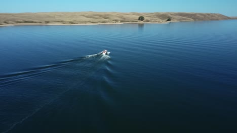 Following-Powerboat-with-Wakeboarders-on-Lake-Near-Calgary