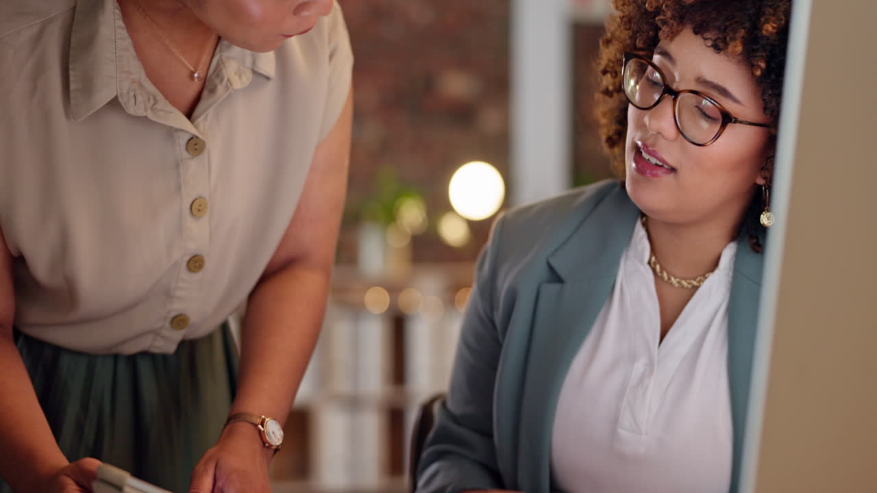 Two Businesswomen Collaborating in an Office