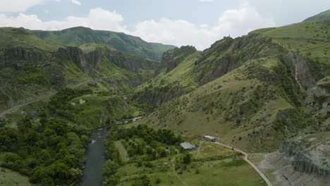 panorama of mtkvari river flowing between the mountains with green vegetation at summer