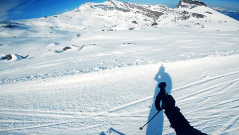 man smiles and enjoying the scenic view of snowy mountains