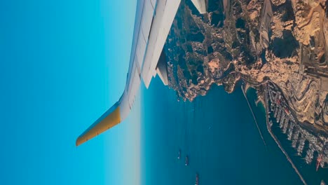 plane coming to land, the port and cargo ships on the way to marseille