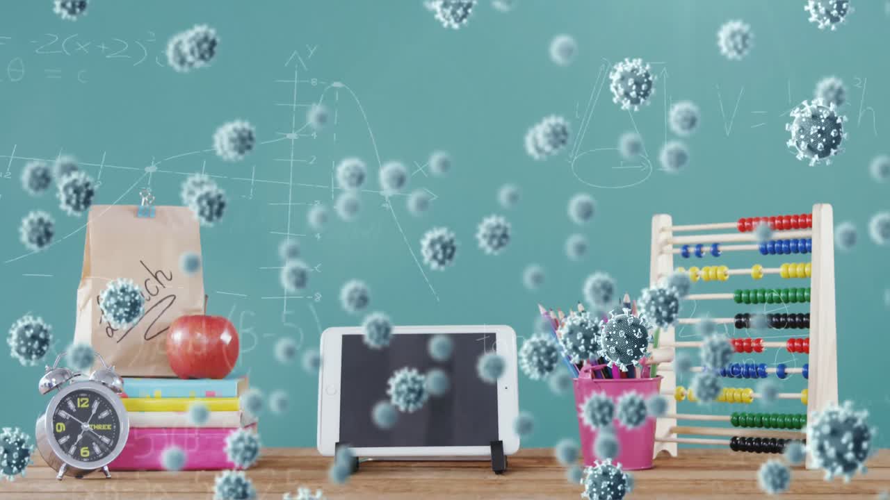 디지털 테이블과 학교 물건 위에 코로나바이러스 세포가 있습니다.