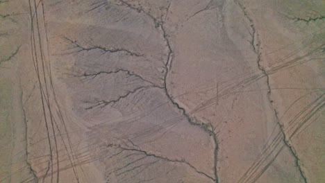 aerial drone 4k view of scenic erosion patterns leading to factory butte in utah’s desert, iconic badlands and rugged terrain