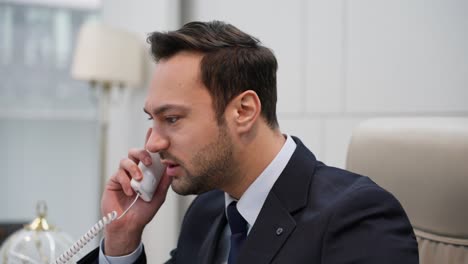 businessman talking on the phone. european man angry, frustrated and furious with his lane phone, angry with customer service. business man shout scream argue problem conflict talking negative call