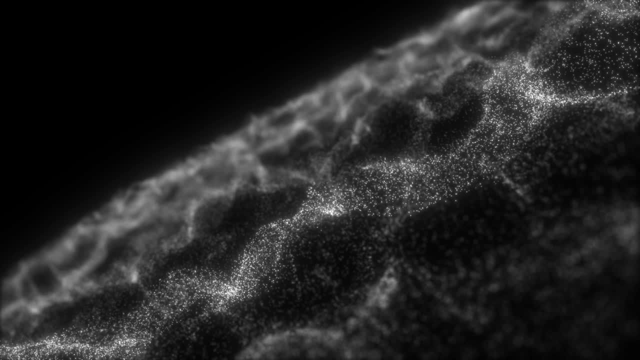A macro view of a rippling surface made of white particles with shallow depth of field. A seamless loop for technology, science, or abstract backgrounds