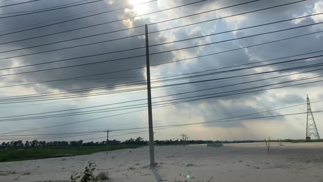 loaded power lines by the side of the road in bangladesh