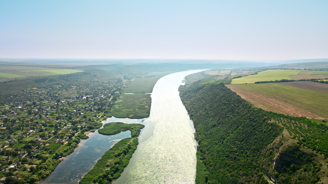 Aerial drone view of nature in Moldova. Village located near a valley with river