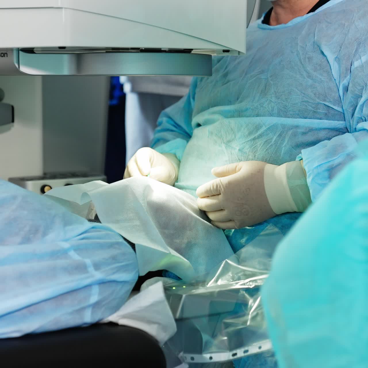 Ophtalmology specialist using microscope for eye operation. Eye laser correction specialists