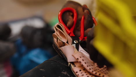 Cropped-View-Of-Shoe-Repair-Man-In-The-Old-Town-Of-Ghardaia,-Algeria