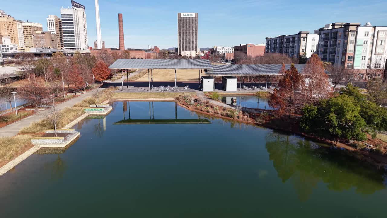 Stunning 4K drone footage of Railroad Park in Birmingham, AL, showcasing green spaces and urban skyline. Ideal for city life, nature, or travel projects