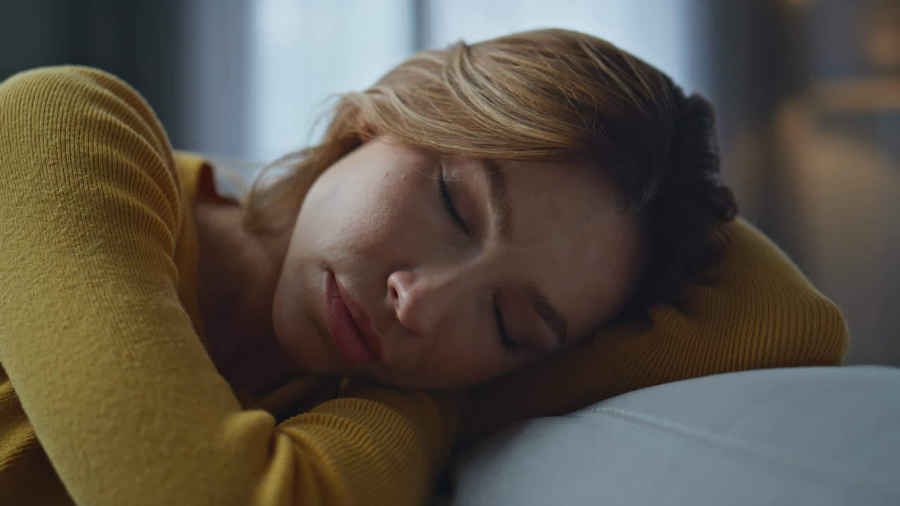 Closeup depressed woman thinking problems evening home. Frustrated girl anxiety