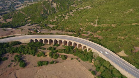 tarifa aerial view overlooking traffic driving curved spanish arched hillside highway