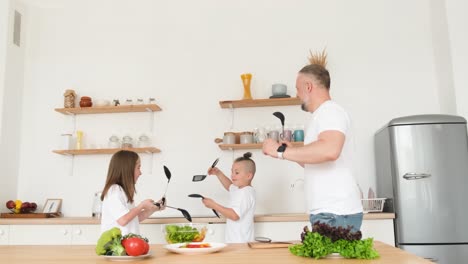 A Crazy Father Dances and Sings with his Children in the Kitchen a Crazy Father Dances and Sings with his Children in the Kitchen a Happy Family is Relaxing in the Kitchen Video