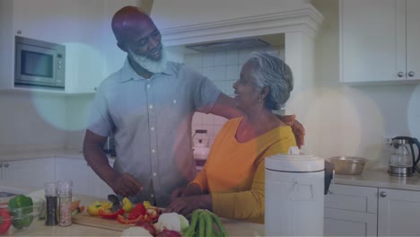 Animation-of-light-spots-over-happy-senior-african-american-couple-cooking