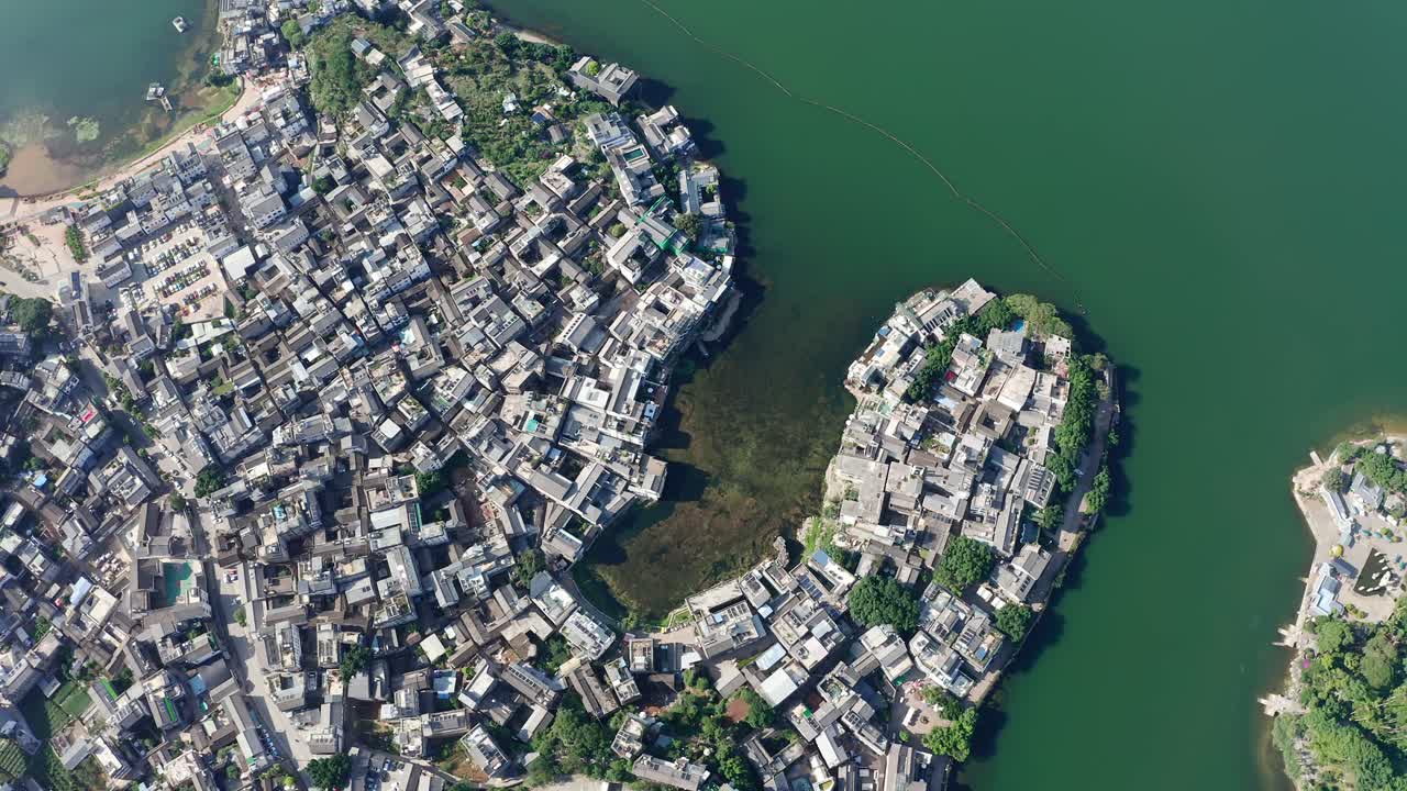 Village and lake in Shuanglang, Yunnan, China.