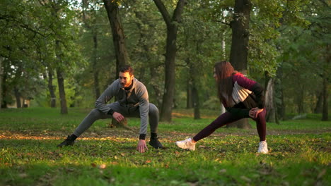 couple stretching in the park