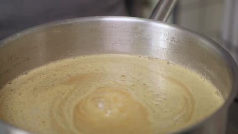Hot-Boiling-Apple-Jam-In-A-Stainless-Pot---close-up,-slow-motion