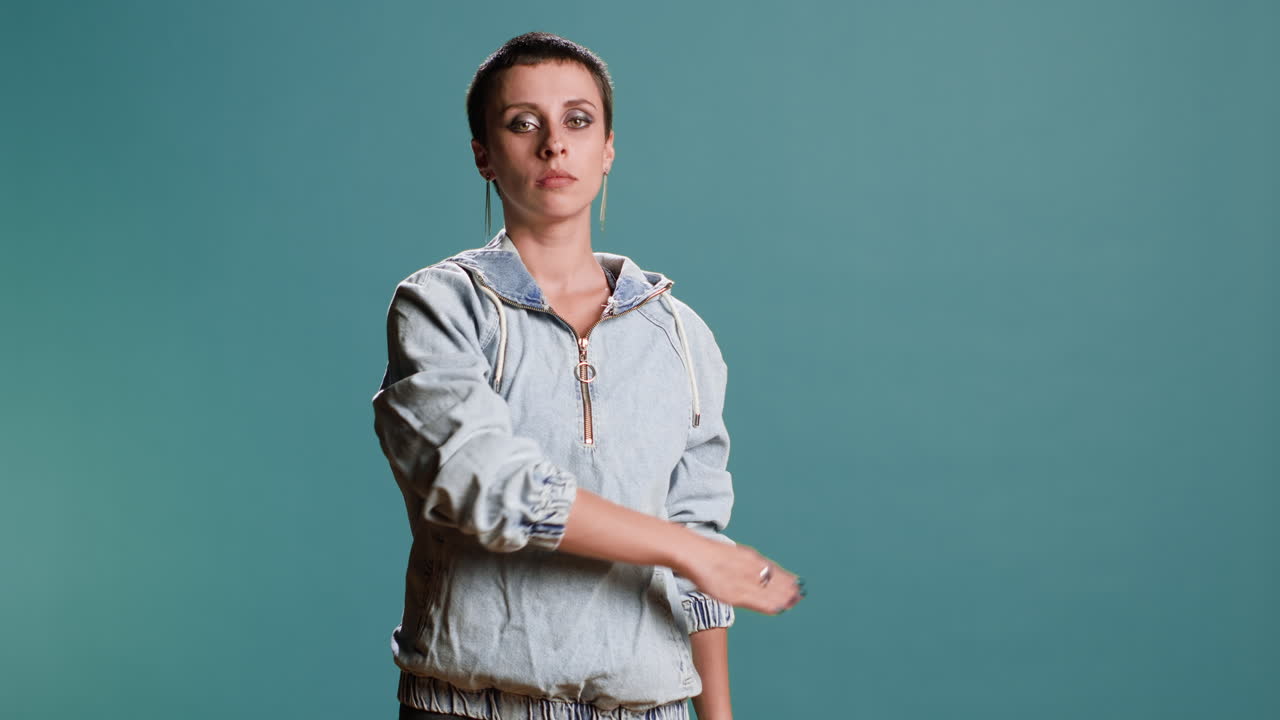 Woman Saluting in Studio Shot