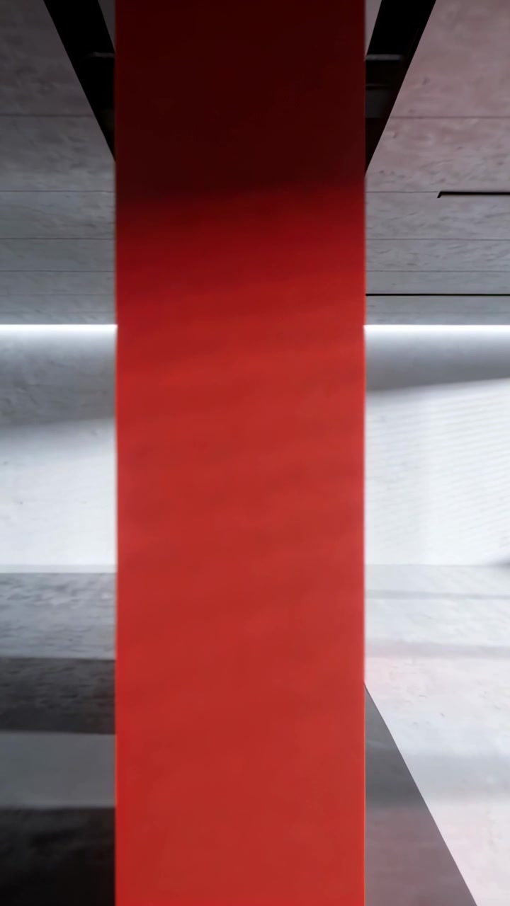 Video verticale: Pannello rosso alto che mostra una debole striscia luminosa da LED in movimento nella hall, con fasci di luce.