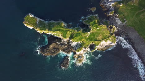 epic downward drone shot of kinbane castle in county antrim, northern ireland