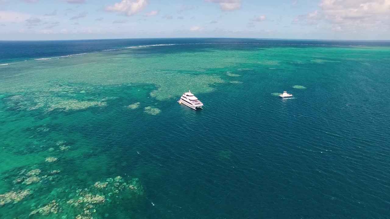 The great barrier reef off the coast of Australia. Scuba diving off this multi million dollar yacht. Drone
