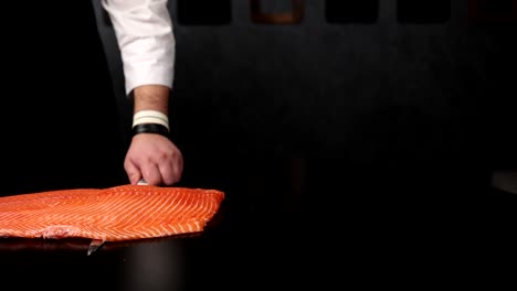 chef preparing raw salmon