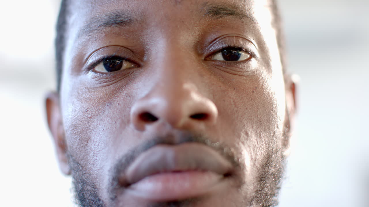 Close-up of an African American man with a beard and thoughtful expression