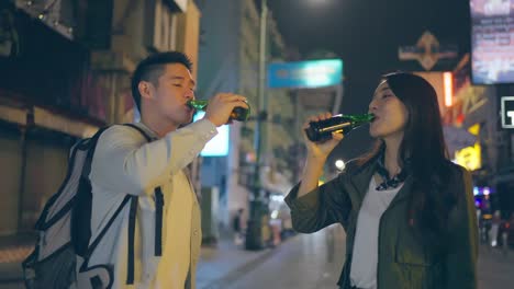 couple enjoying night drinks on a city street