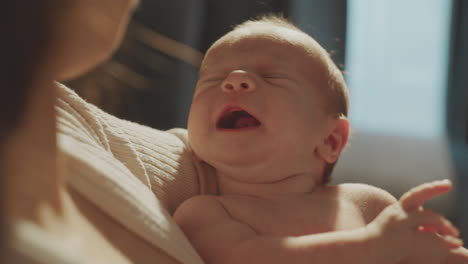 baby in mother's arms