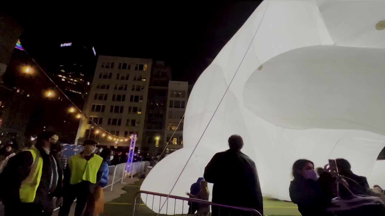 A giant 50 foot rabbit in downtown Pittsburgh for the city's First Night celebrations. Pittsburgh downtown market square during Christmas holiday season.