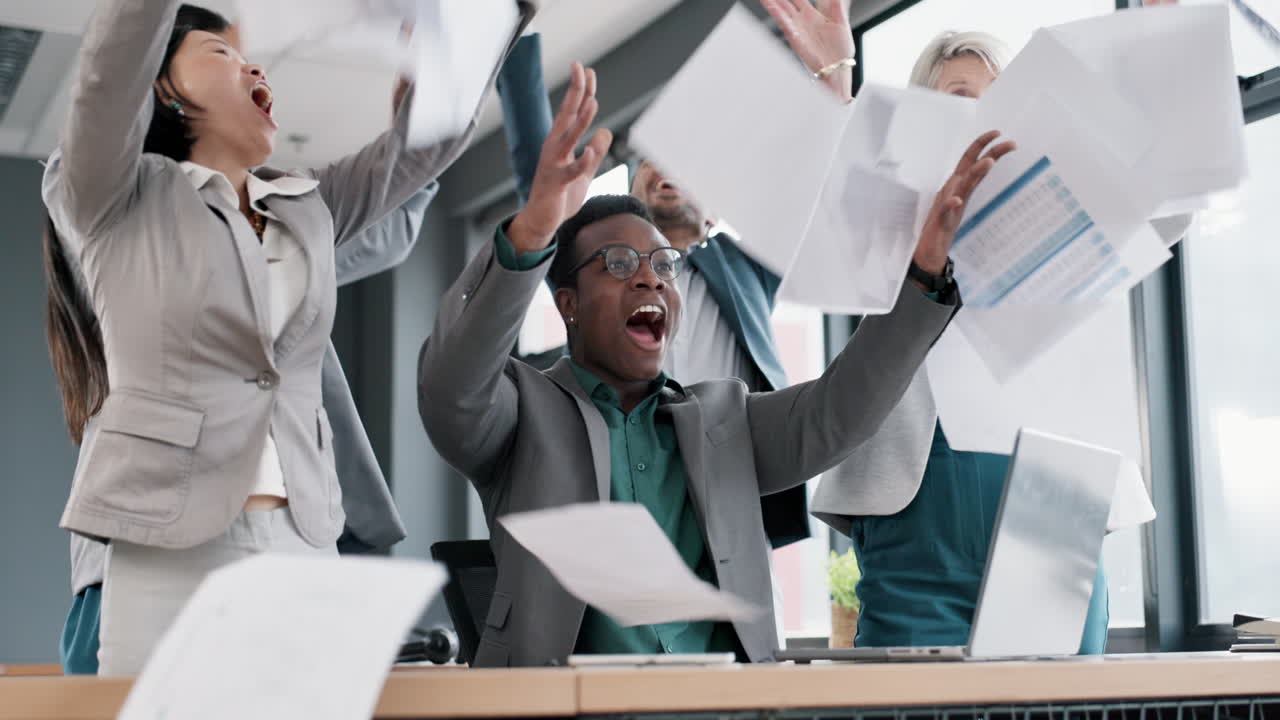 Business people throw papers in meeting success