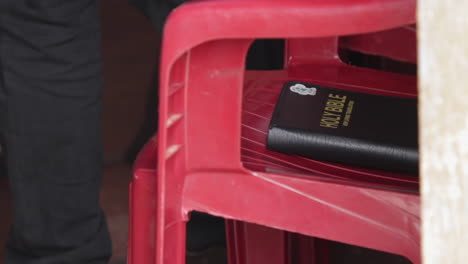 holy bible on a red chair