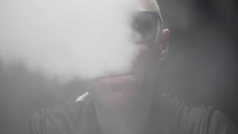 man smoking vape