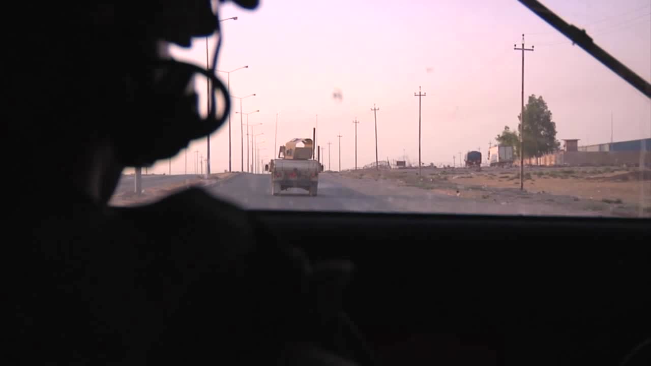 Pov Shot From An Armored Humvee Of Us Soldiers In A Convoy On A Highway In Iraq