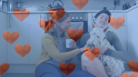 animación de iconos de corazón rojo sobre pareja de mujeres con perro mascota.
