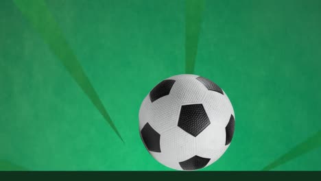 Animation-of-football-over-shapes-on-green-background