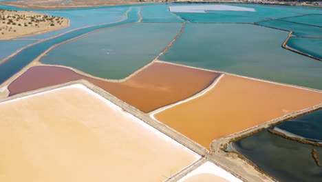 Aerial-View-Of-Colorful-Minerals-At-Salt-Pan-In-Portugal