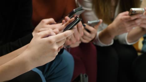 group of people using smartphones