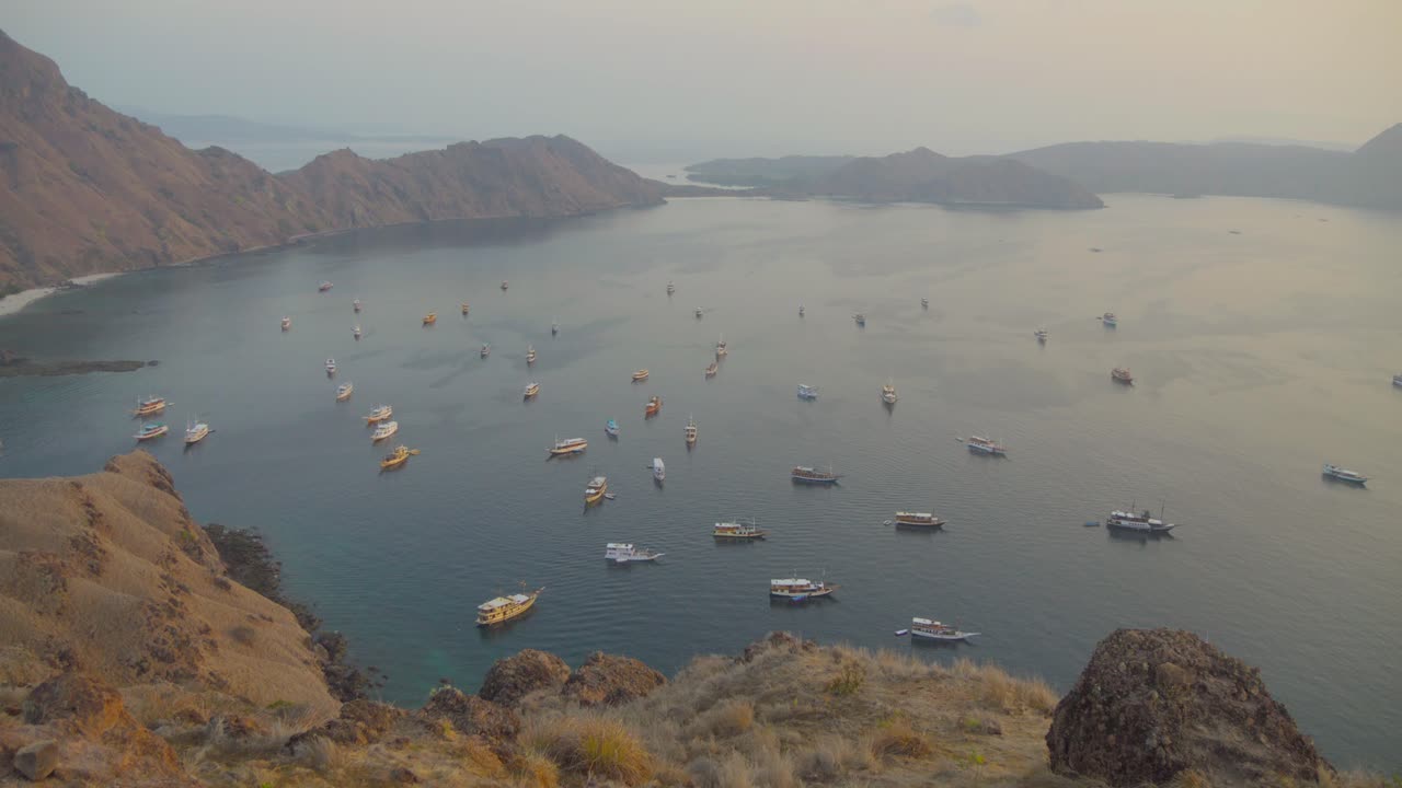 Bay of Padar island seen from promontory on foggy day, Indonesia
