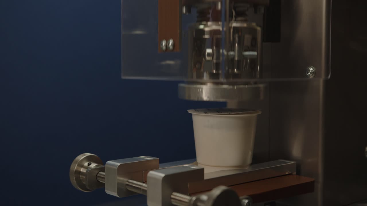 Aluminum lid sealer demonstration on the yogurt cup