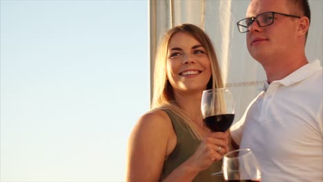 couple enjoying wine on a sailboat