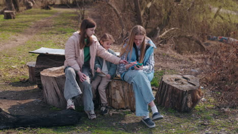 girls using smartphone outdoors