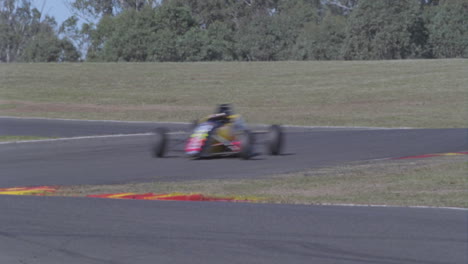 formula cars racing on a circuit track 1