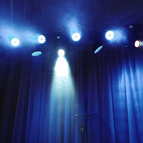 stage lighting with blue haze and spotlight