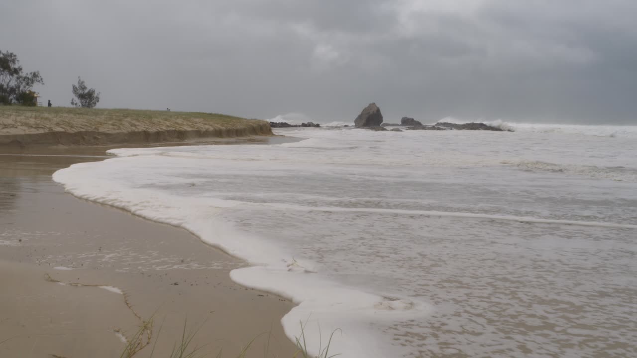 Foamy Sea Waves Splashing On Shore Of Currumbin Alley During Cyclone Alfred In Australia - Wide Shot