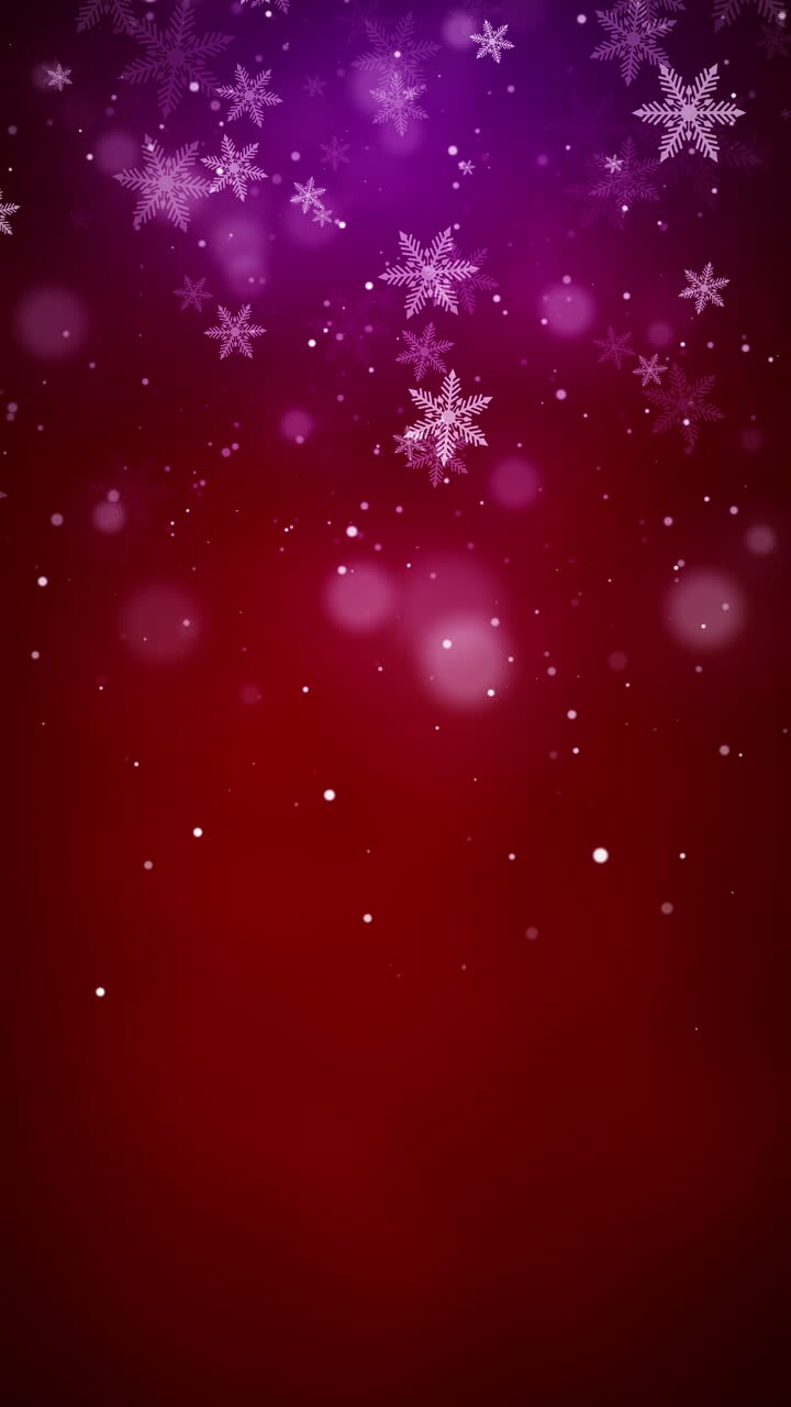 Festive winter scene with a gradient red background. White snowflakes of varying sizes adorn the upper part, creating a joyful holiday atmosphere. Loop animation. Vertical video.