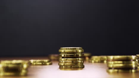 animated coin stacks reduce one by one in stop motion, symbolizing money loss and decline
