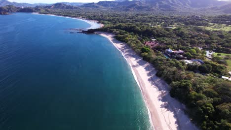this is playa conchal, one of the best beaches in the world with white sand full of shells and crystal clear waters