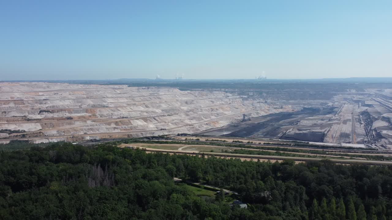 Hambach opencast lignite mine in the Rhenish lignite mining area near Düren in Germany, Aerial backwards